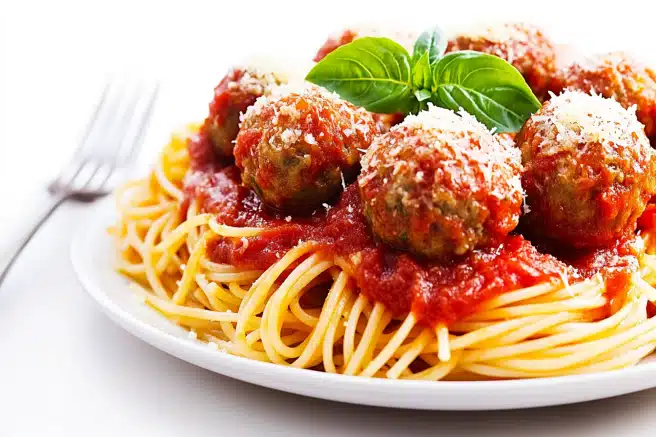 How do Italians serve spaghetti and meatballs?